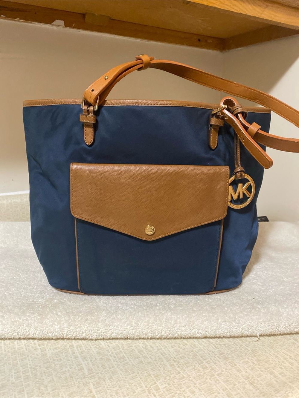 MICHAEL KORS Navy Tote with Tan Leather Trim and MK Charm